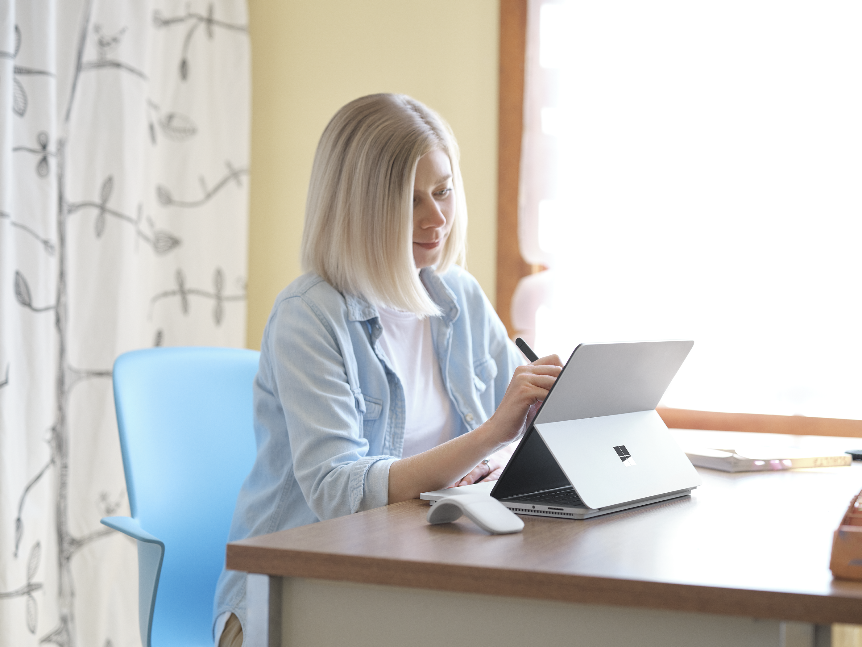 woman working on Surface device